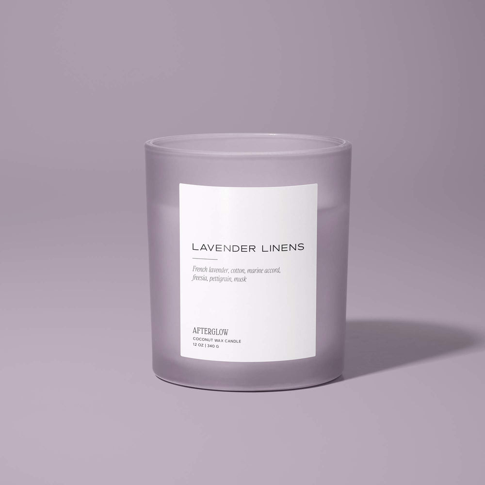 Afterglow's Lavender Linens jar candle with a purple background