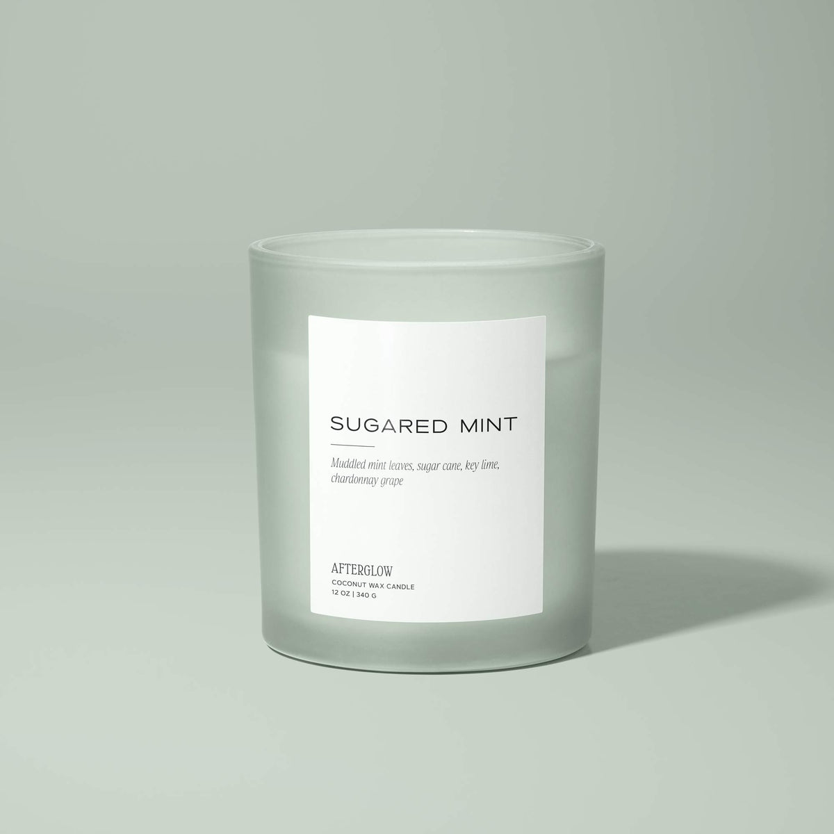 Afterglow's Sugared Mint jar candle with a light green background